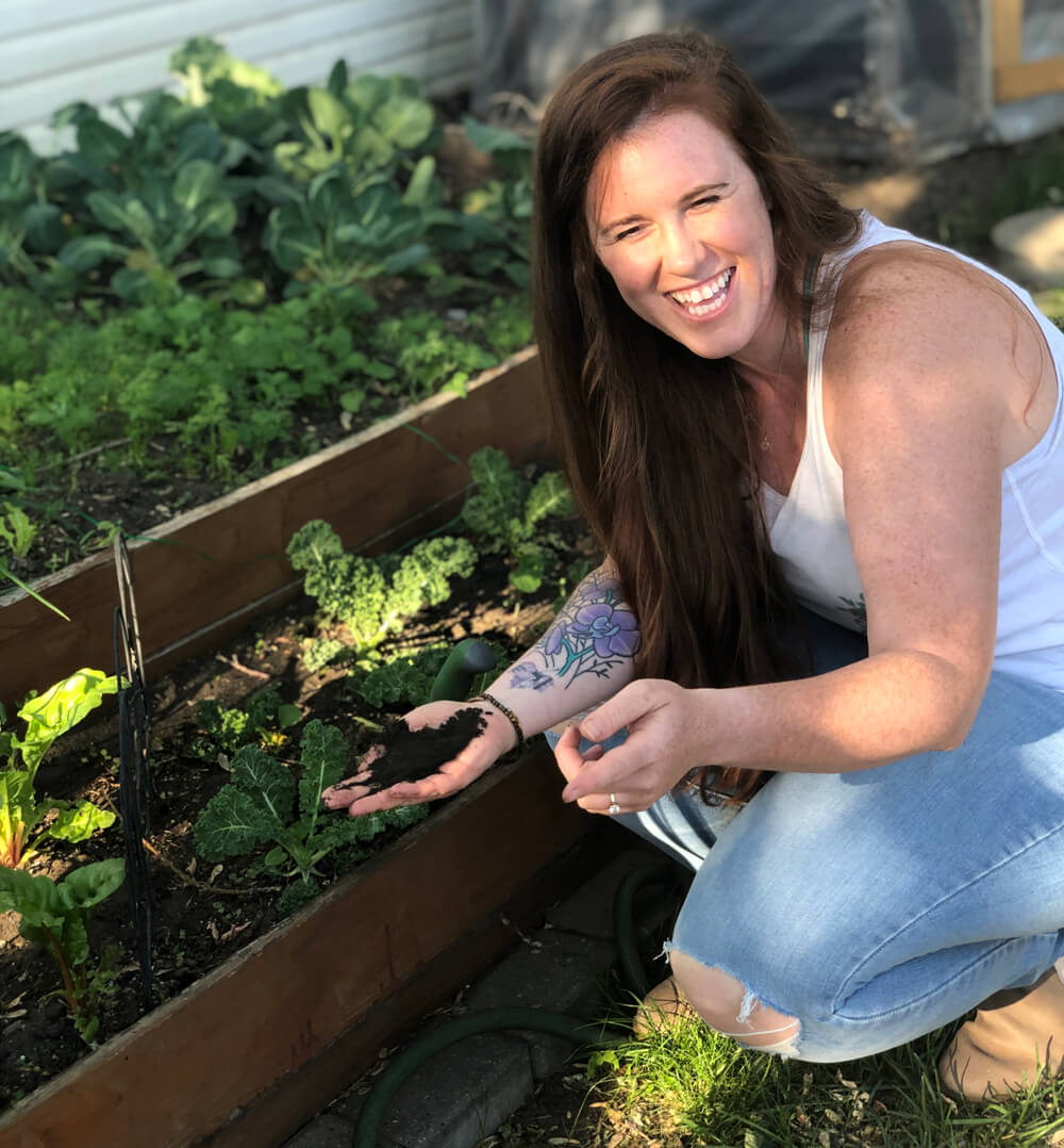 woman with soil in her hands