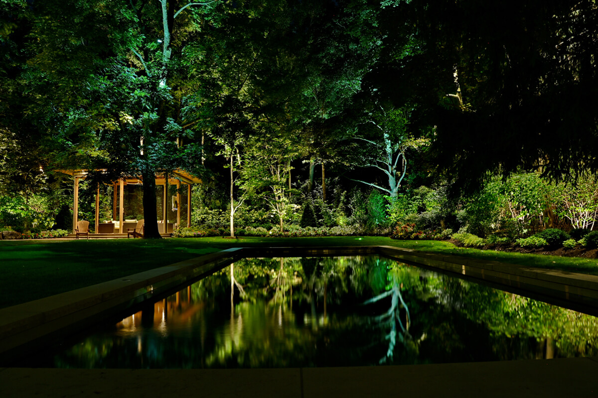 large backyard lit up at night