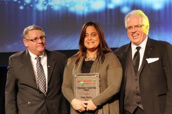 Recipient receiving an award on stage